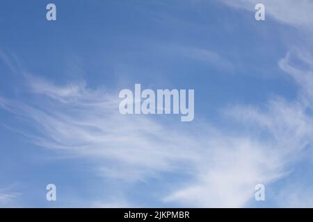 Blue sky with white little cirrus clouds. Stock Photo