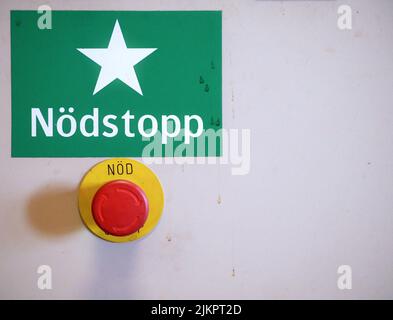 swedisch language emergency stop sign and button Stock Photo