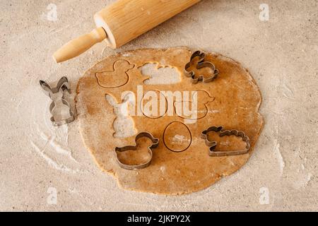 Easter baking flat lay.Spring symbols made from gingerbread.Homemade cookies.Easter bunny,rabbit,eggs and ducks from delicious honey dough. Stock Photo