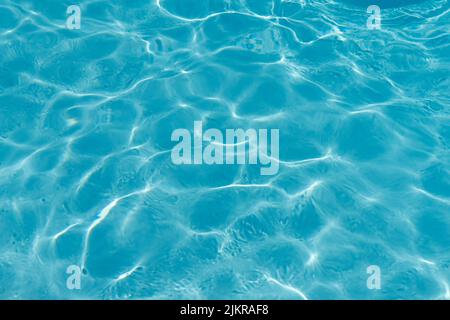 Blue rippled water in swimming pool background Stock Photo