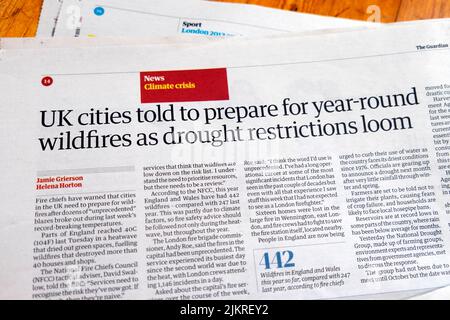 'UK cities told to prepare for year-round wildfires as drought restrictions loom'  newspaper headline article in Guardian 29 July 2022 London UK Stock Photo