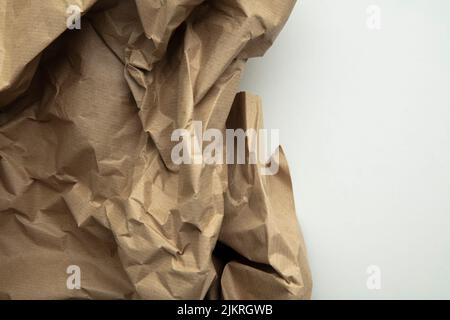 crumpled brown kraft paper background. Recycle old brown paper texture Stock Photo