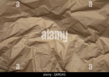 crumpled brown kraft paper background. Recycle old brown paper texture Stock Photo