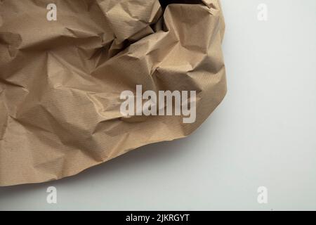 crumpled brown kraft paper background. Recycle old brown paper texture Stock Photo