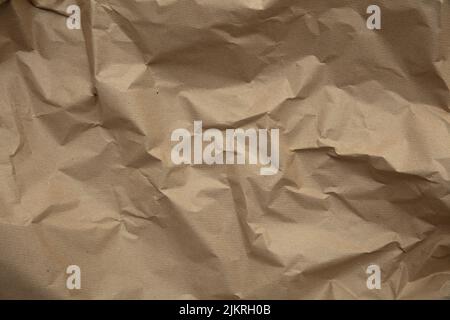crumpled brown kraft paper background. Recycle old brown paper texture Stock Photo