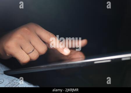 man hand using digital tablet on black background  Stock Photo