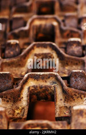 Old rusty crawler tractor tracks, closeup with selective focus Stock Photo