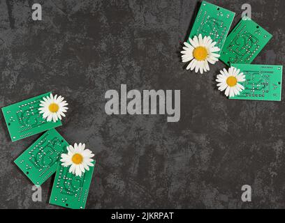 Electronic printed circuit boards on a dark background. Repair of electronic devices in the workshop. Disposal of electronic waste. The concept of eco Stock Photo