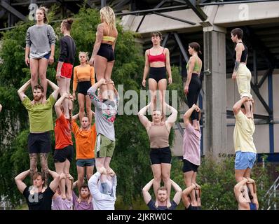 Performers from contemporary circus company Gravity & Other Myths during the launch the 75th Edinburgh International Festival at Murrayfield Stadium in Edinburgh. Picture date: Wednesday August 3, 2022. Stock Photo