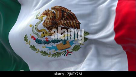 Close-up view of the mexican national flag waving in the wind. Mexico is a country in the southern portion of North America. Fabric textured backgroun Stock Photo