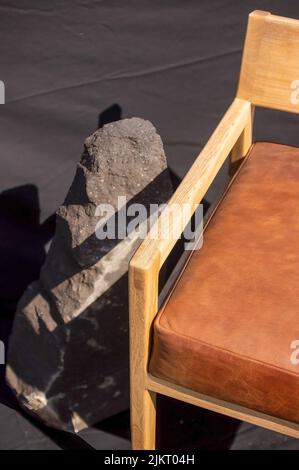 designer chair, solid wood seat in fabric or natural leather, Stock Photo