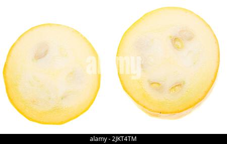 Two slices of yellow zucchini on white background Stock Photo