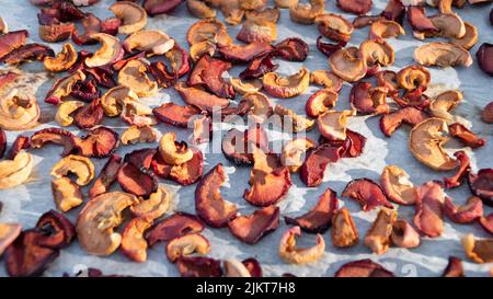 Sun dried apple slices. Raw organic dried apple fruit slices high angle view. Stock Photo
