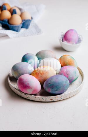 Easter eggs painted with bright colours on a white background. Close-up, isolated. Happy Easter! Preparation for the holiday Stock Photo