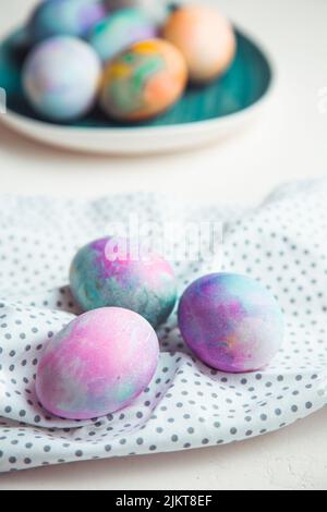 Easter eggs painted with bright colours on a white background. Close-up, isolated. Happy Easter! Preparation for the holiday Stock Photo