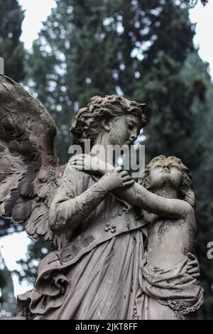 A sculpture of angels in a park Stock Photo