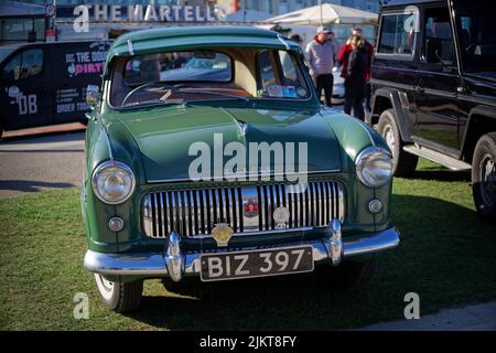 Front view of green classic Ford Consul from 1950s at the Bray Vintage Car Club show. An open air retro cars display on sunny day. Stock Photo