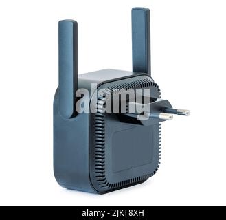 Black wi-fi range extender with small antennas, plugged into an electrical outlet. Isolated with clipping path on white background Stock Photo