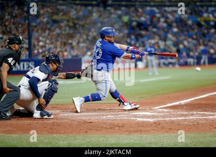 ST. PETERSBURG, FL - MAY 15: Toronto Blue Jays catcher Alejandro Kirk (30)  celebrates his double with his teammates in the dugout during the MLB  regular season game between the Toronto Blue