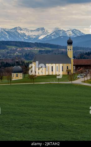 A breathtaking area has green landscape with small building on the road through Austrian Alps to Italy. Stock Photo