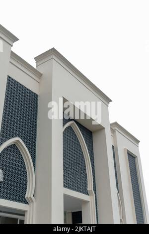 Minimalist Mosque Building Exterior With White Sky Stock Photo