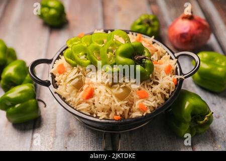 A closeup of Indian traditional dish Biryani with rice and vegetables on a plate Stock Photo