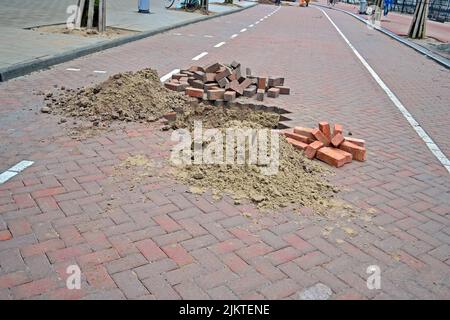 brick road under repair, modern brick (stone) highway reconstruction diversity Stock Photo