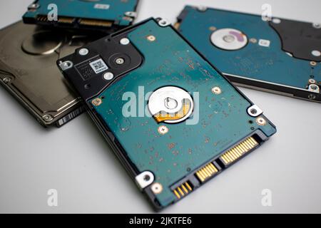 Stack of internal laptop hard drives in a pile scattered Stock Photo