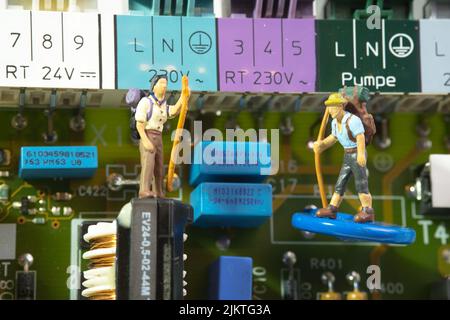 close-up view of a hiking team on an electronic circuit board Stock Photo