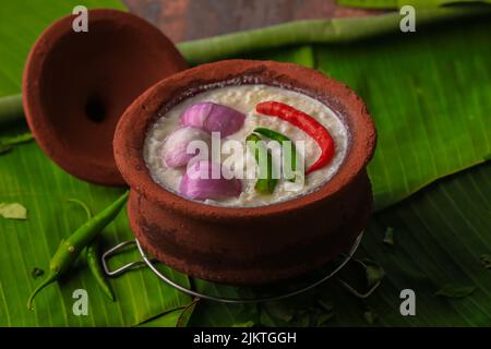 chaddannam indian  famous traditional fermented rice with curd rice,curd rice with onions and chillies in a mud pot closeup with selective focus Stock Photo