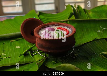 chaddannam indian  famous traditional fermented rice with curd rice,curd rice with onions and chillies in a mud pot closeup with selective focus Stock Photo