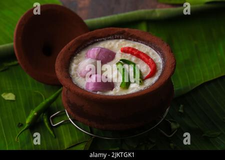 chaddannam indian  famous traditional fermented rice with curd rice,curd rice with onions and chillies in a mud pot closeup with selective focus Stock Photo