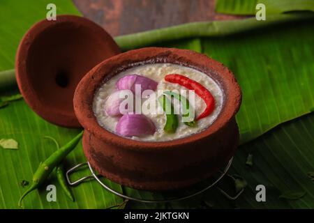 chaddannam indian  famous traditional fermented rice with curd rice,curd rice with onions and chillies in a mud pot closeup with selective focus Stock Photo