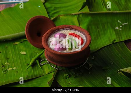 chaddannam indian  famous traditional fermented rice with curd rice,curd rice with onions and chillies in a mud pot closeup with selective focus Stock Photo