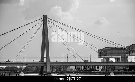 A grayscale of the Vansu Bridge (Latvian: Vansu tilts) in Riga that crosses the Daugava river in Riga Stock Photo