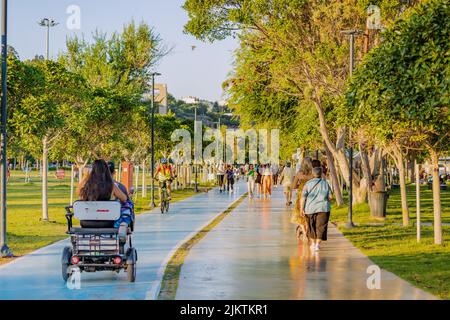 17 June 2022, Antalya, Turkey: There is a bicycle and a pedestrian path on the Antalya embankment. People are walking and enjoying the weather and the Stock Photo