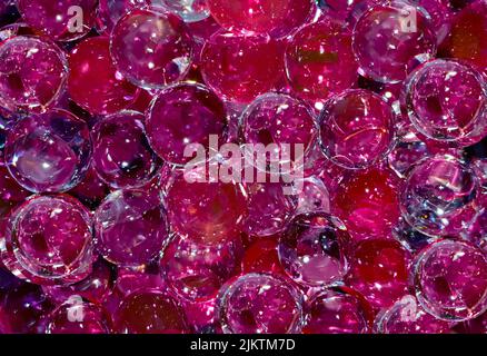 many purple red transparent balls in closeup Stock Photo