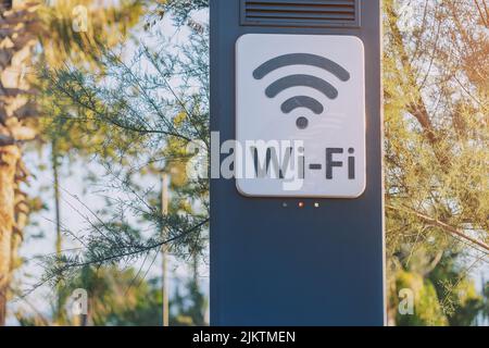 Wi-fi access point for wireless connection and digital communication in city park. Modern technology for lifestyle convenience Stock Photo