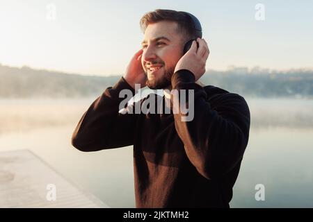 Man enjoying music outside. Inspiration and happiness. Stock Photo