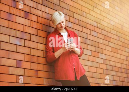 Young guy looking at his smart phone. Stock Photo