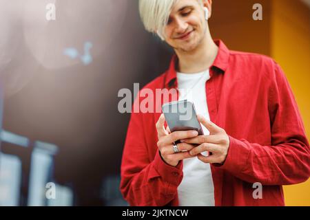 Young man communicating through mobile smart phone. Communication concept. Stock Photo