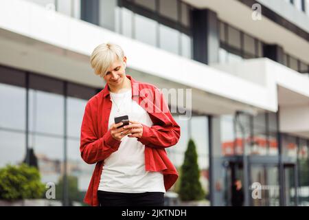 Man with a phone in hand using an app. Stock Photo