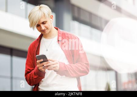 Young man using technology and digital services. Stock Photo