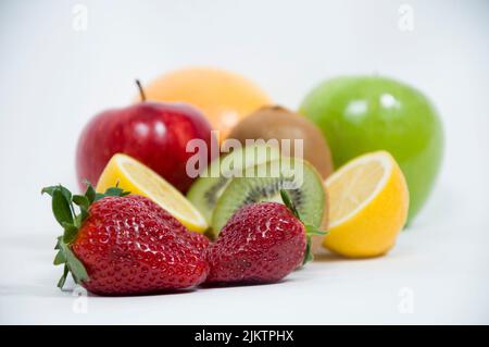 A closeup shot of sliced fruits on white background Stock Photo