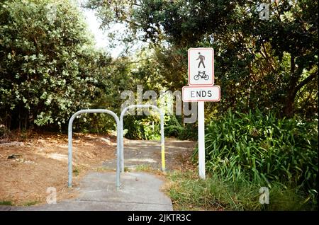 A bicycle road and ends sign at public park Auckland Stock Photo