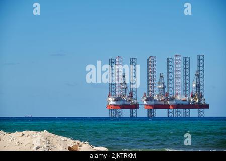 The offshore oil drilling rig platform on a sea Stock Photo
