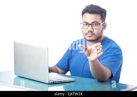 young man showing empty hand for invisible product to place on hand Stock Photo
