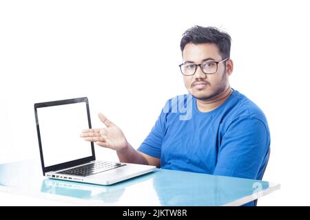 office guy showing blank laptop screen and pointing hands towards something on the screen Stock Photo