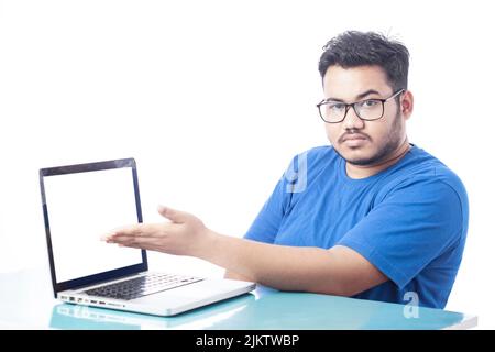 corporate man showing blank laptop screen Stock Photo