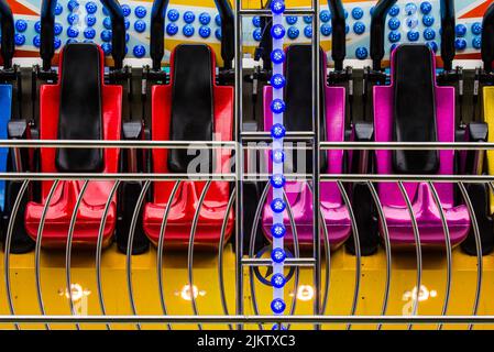 Seats from the 'Miami' ride at Kirtlington Feast funfair.  June 2017 Stock Photo